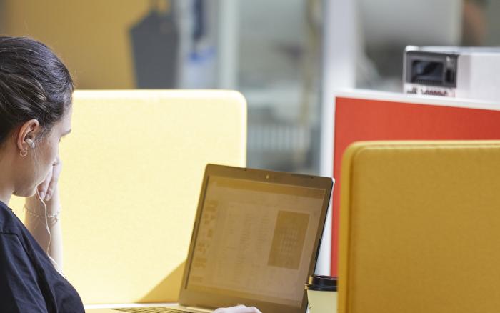 A researcher in a quiet study space at the Crick.