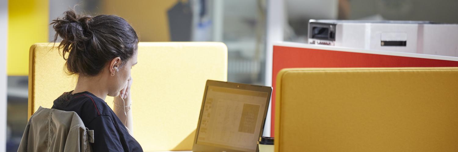 A researcher in a quiet study space at the Crick.