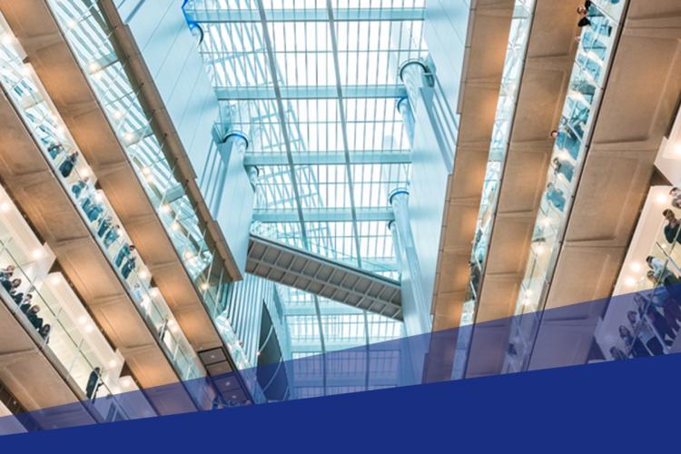 Atrium of Crick with researchers looking down.